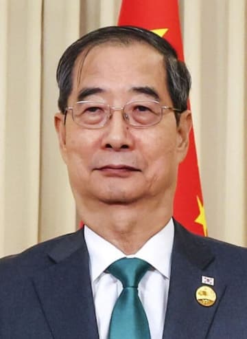 韓国首相が辞任、大統領選出馬へ　与党と候補一本化も
